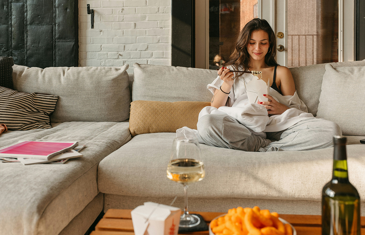 a woman eating noodles