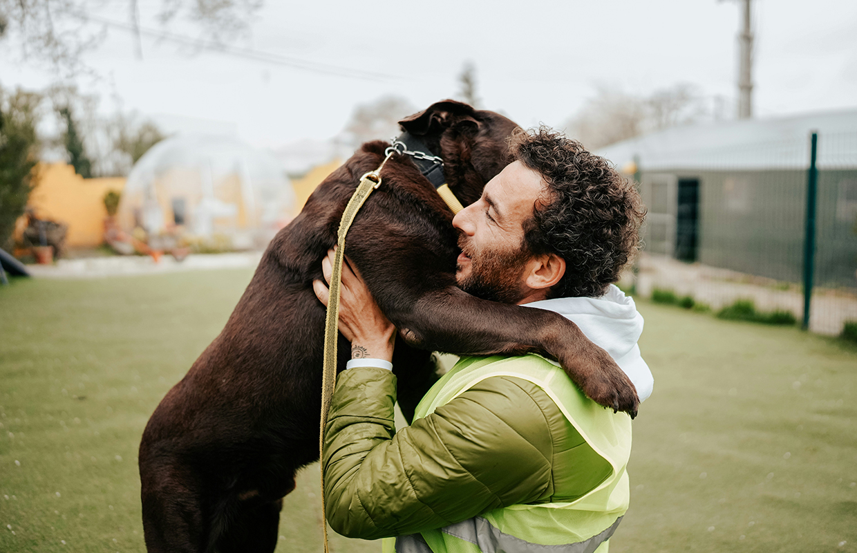 Man hugging a dog