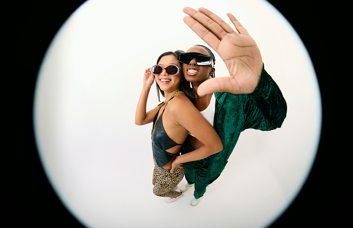 a couple posing wearing sunglasses