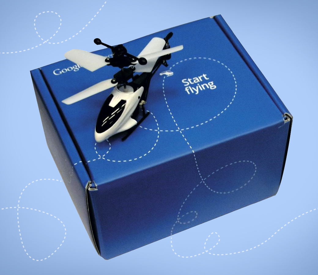 Blue Google box with text 'Start flying' and a small toy helicopter on top