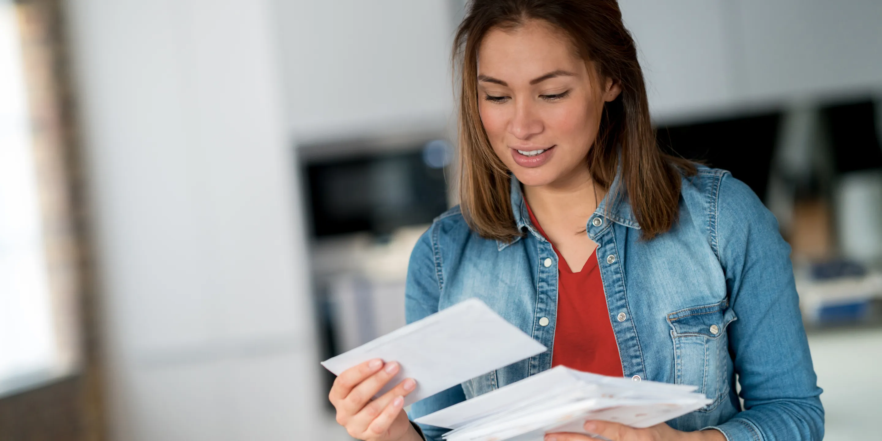 A woman reading her mail