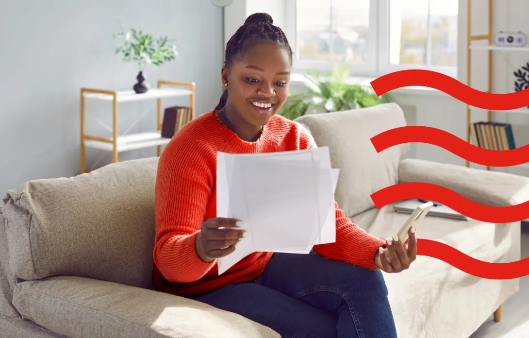 Woman happily reading a letter